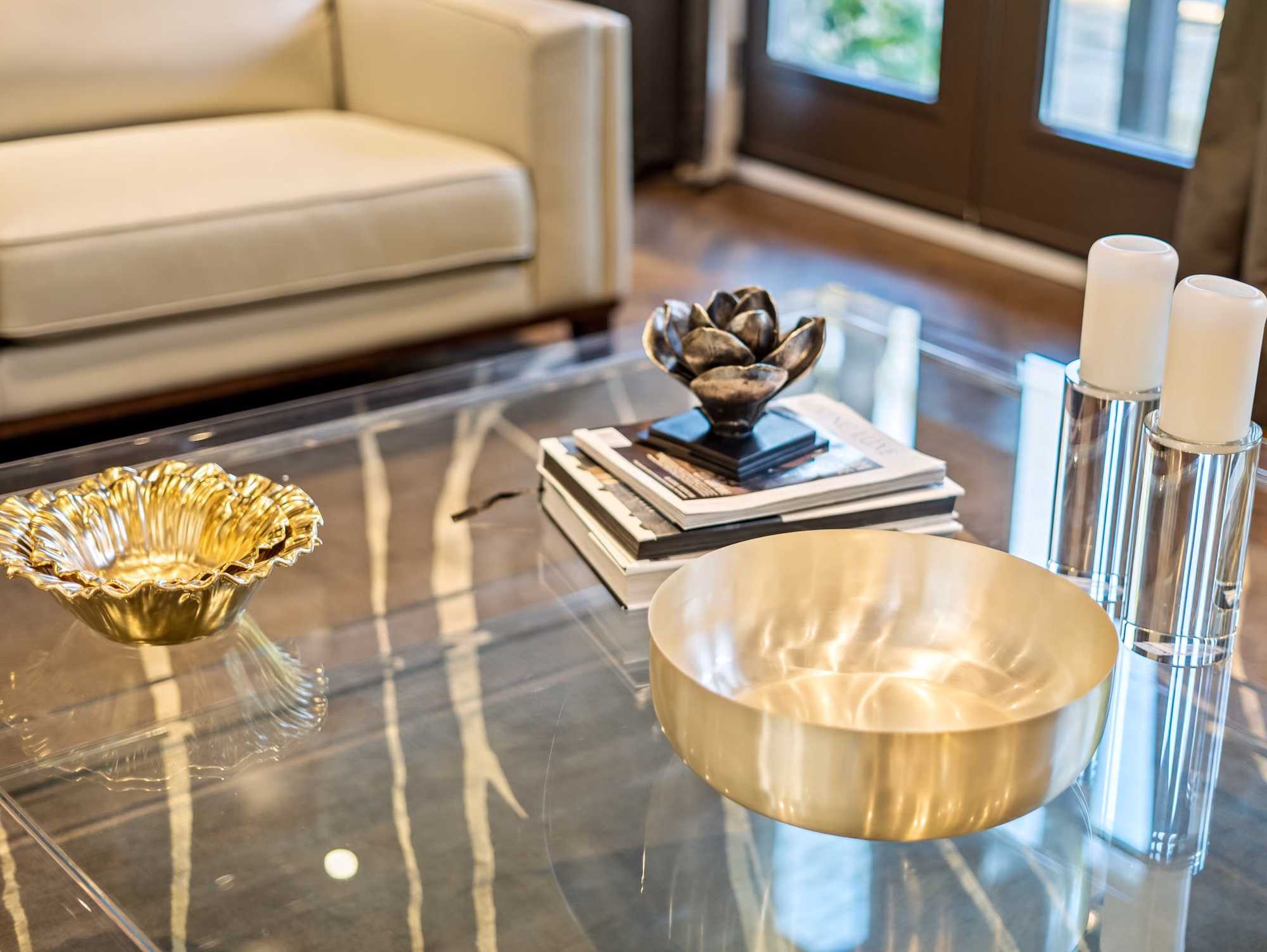 Coffee table detail with brass bowls on marble