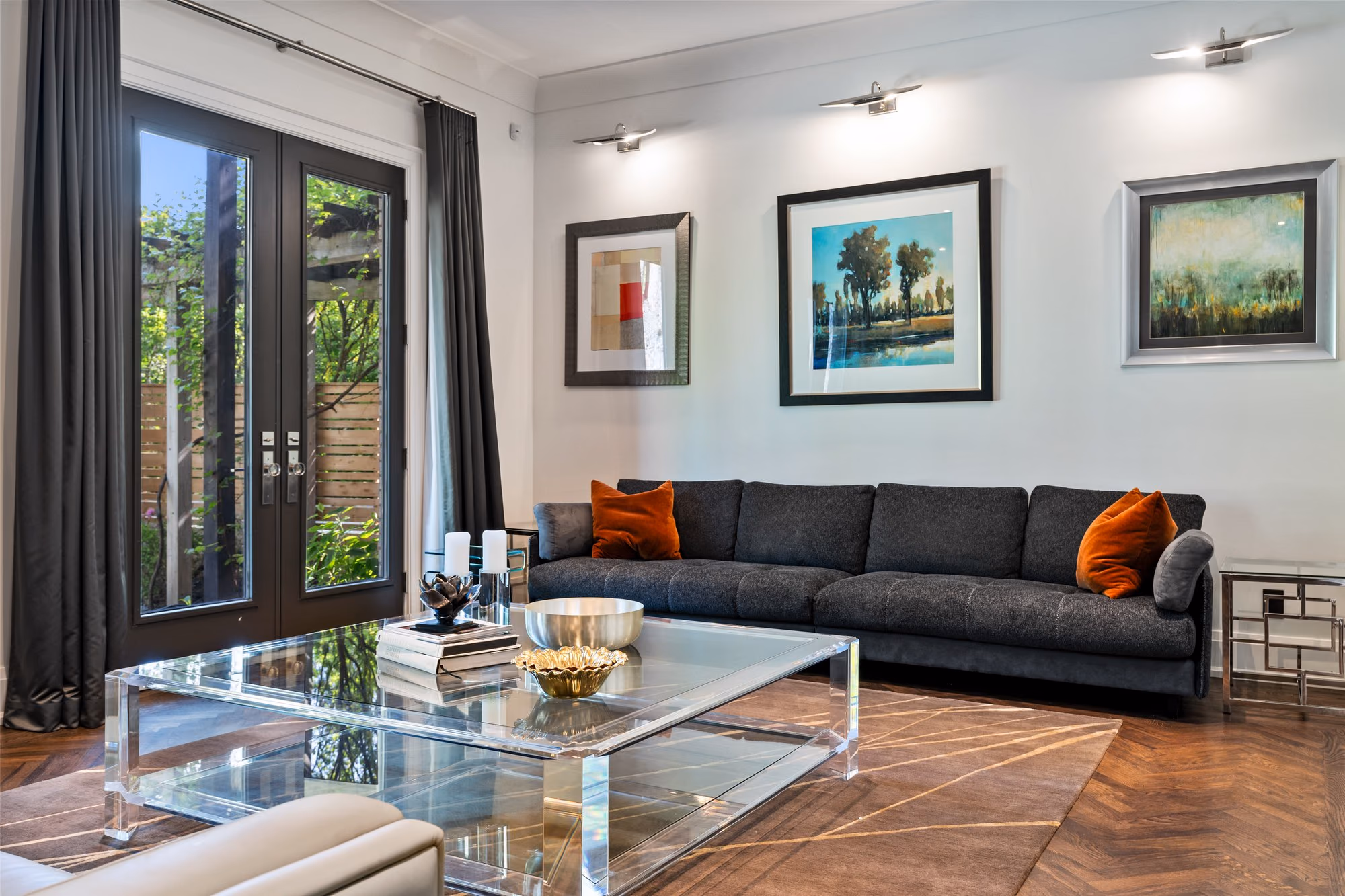 Living room with charcoal sofa and gallery wall