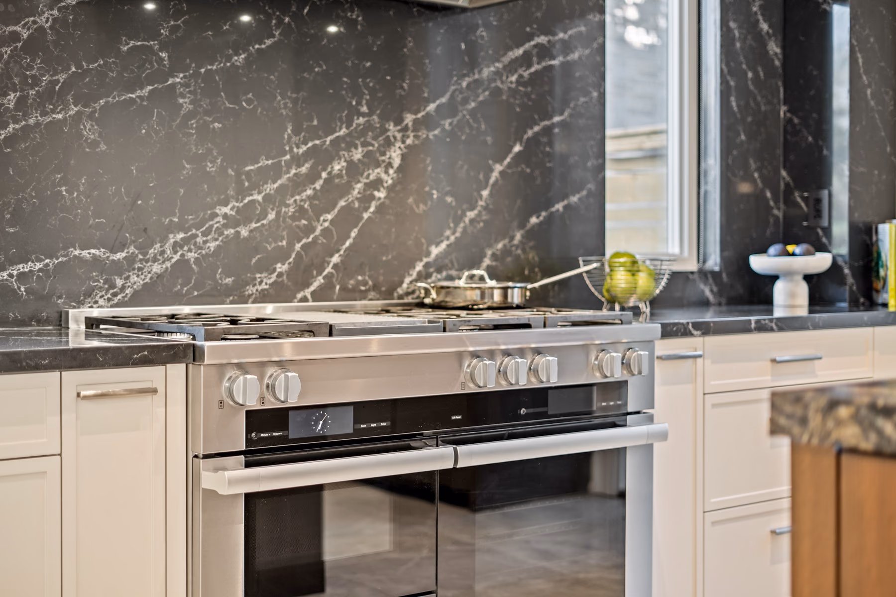Range and dark quartz backsplash detail