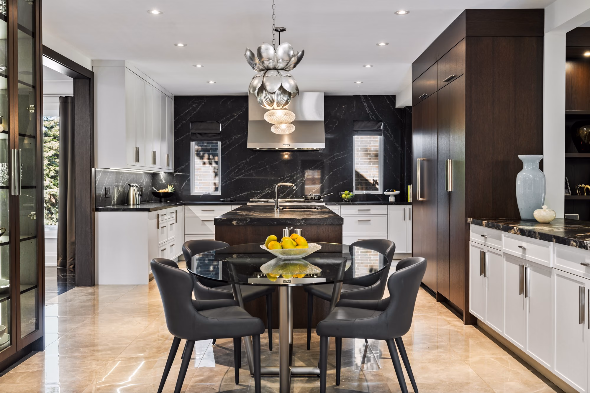 Dining area with glass display cabinet and lotus pendant light