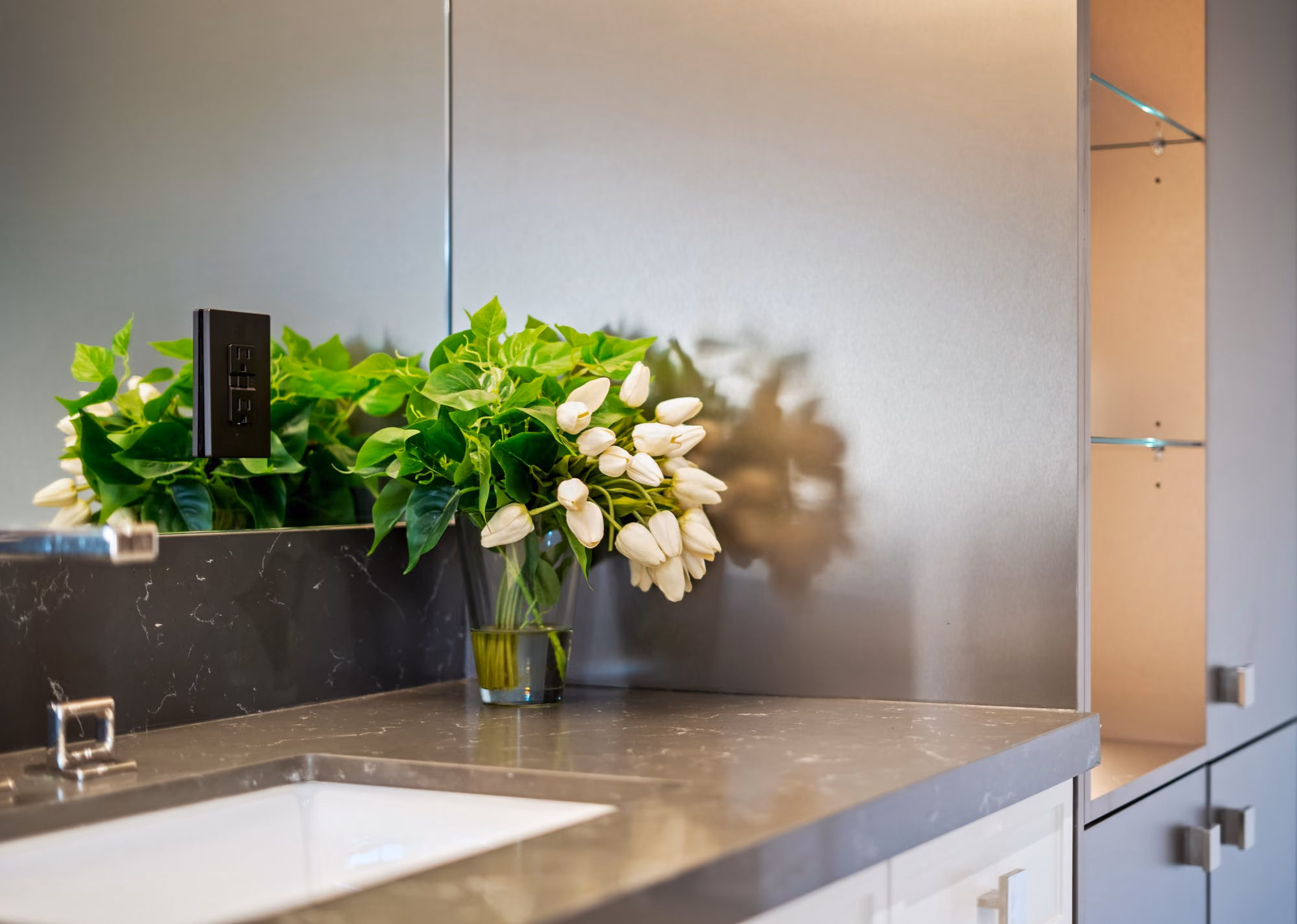 White tulips on the bathroom counter