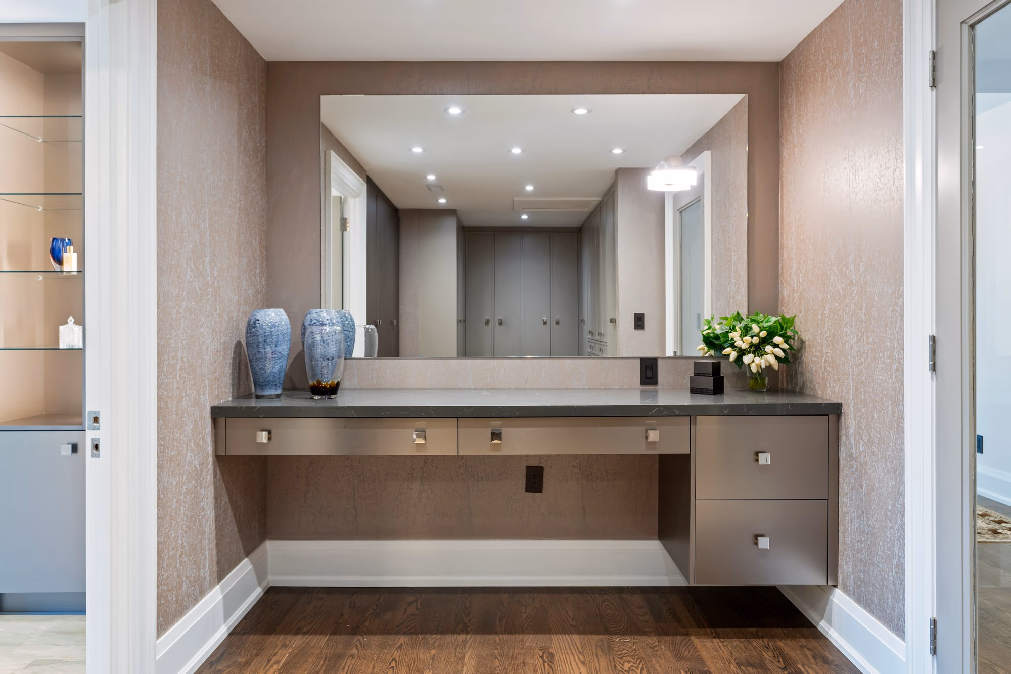 Dressing suite with long floating vanity and wide mirror