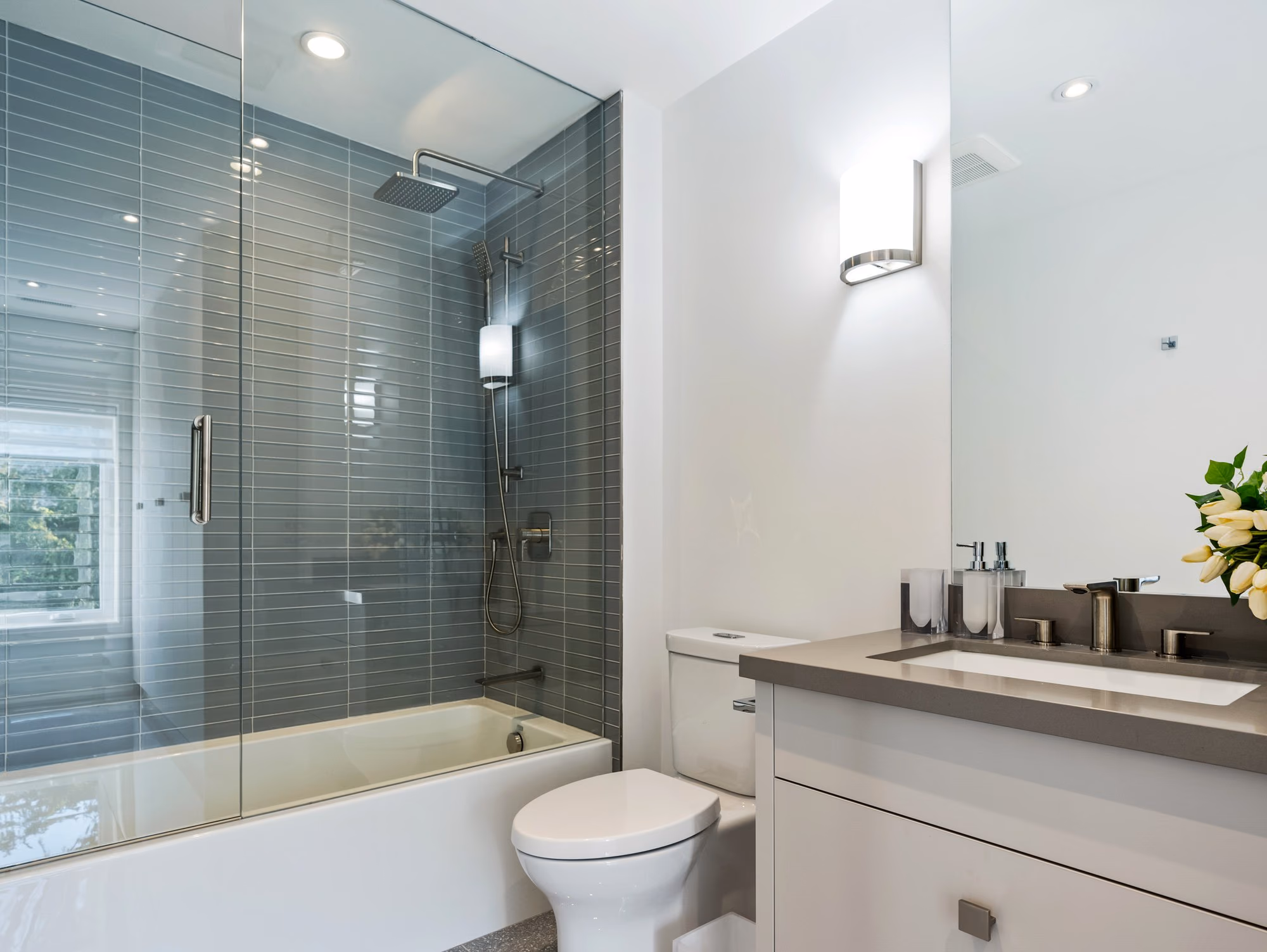 Bathroom with tub, vanity and glass shower