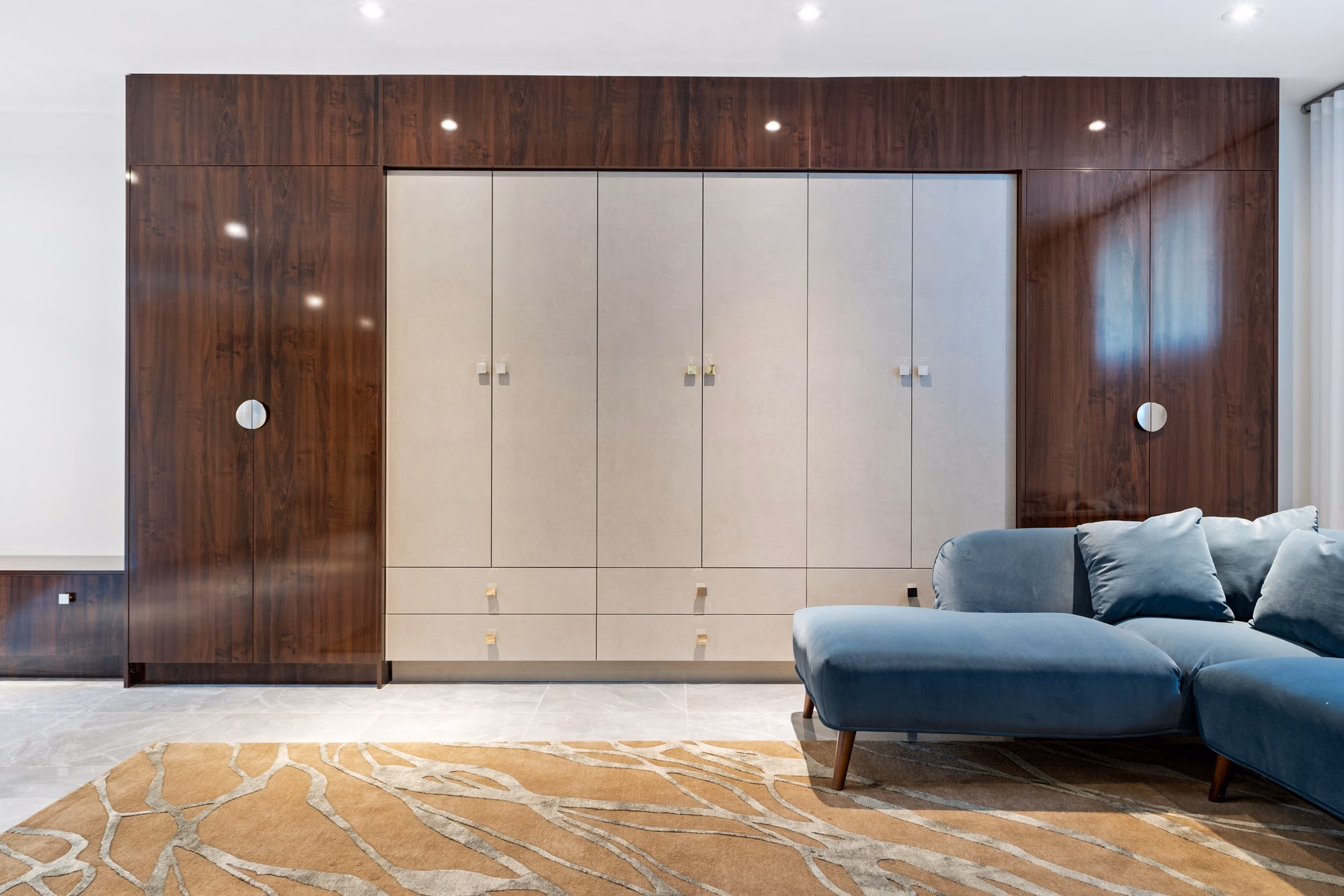 Sitting area with wood-panelled wardrobe wall