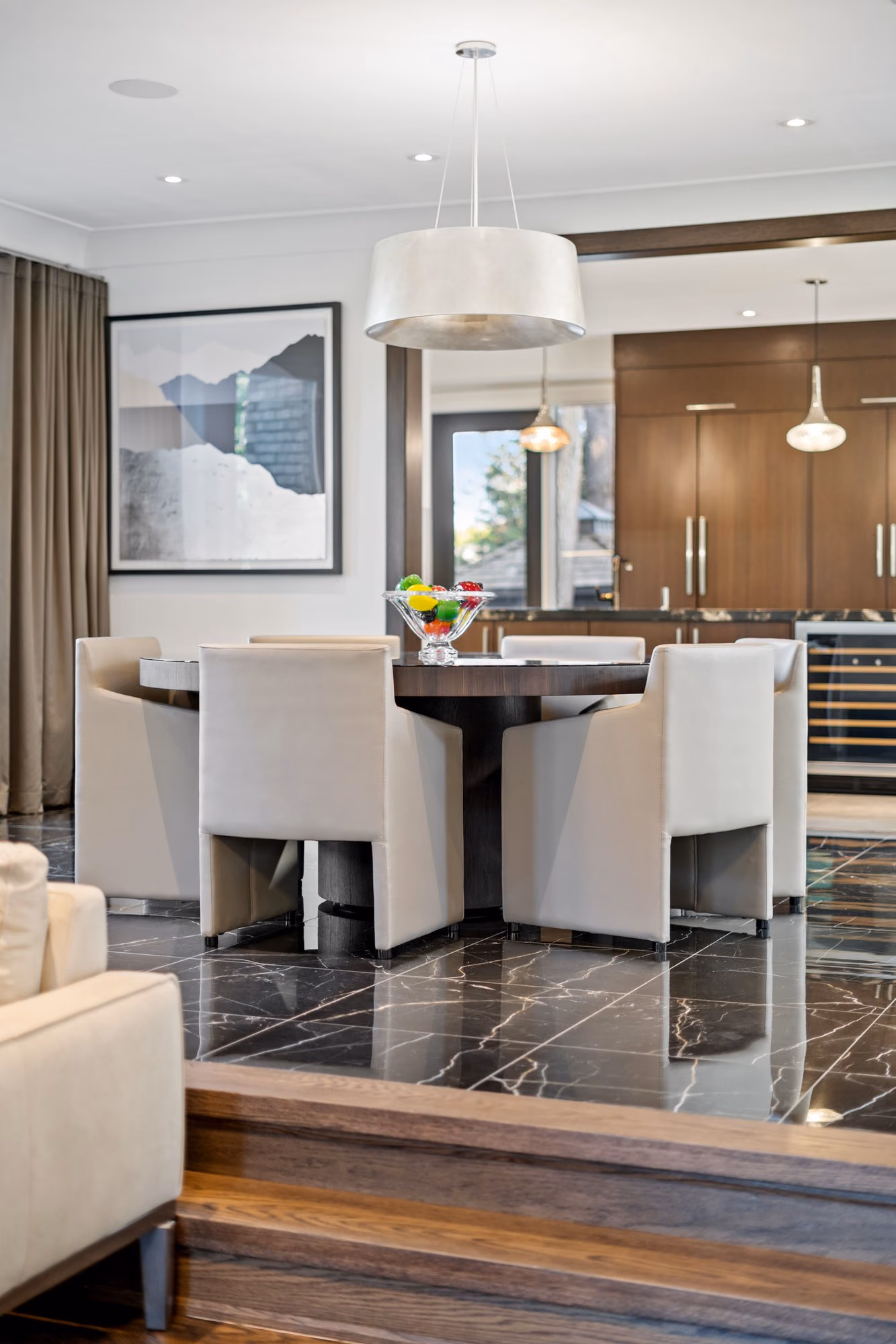 Dining area with silver pendant over the table