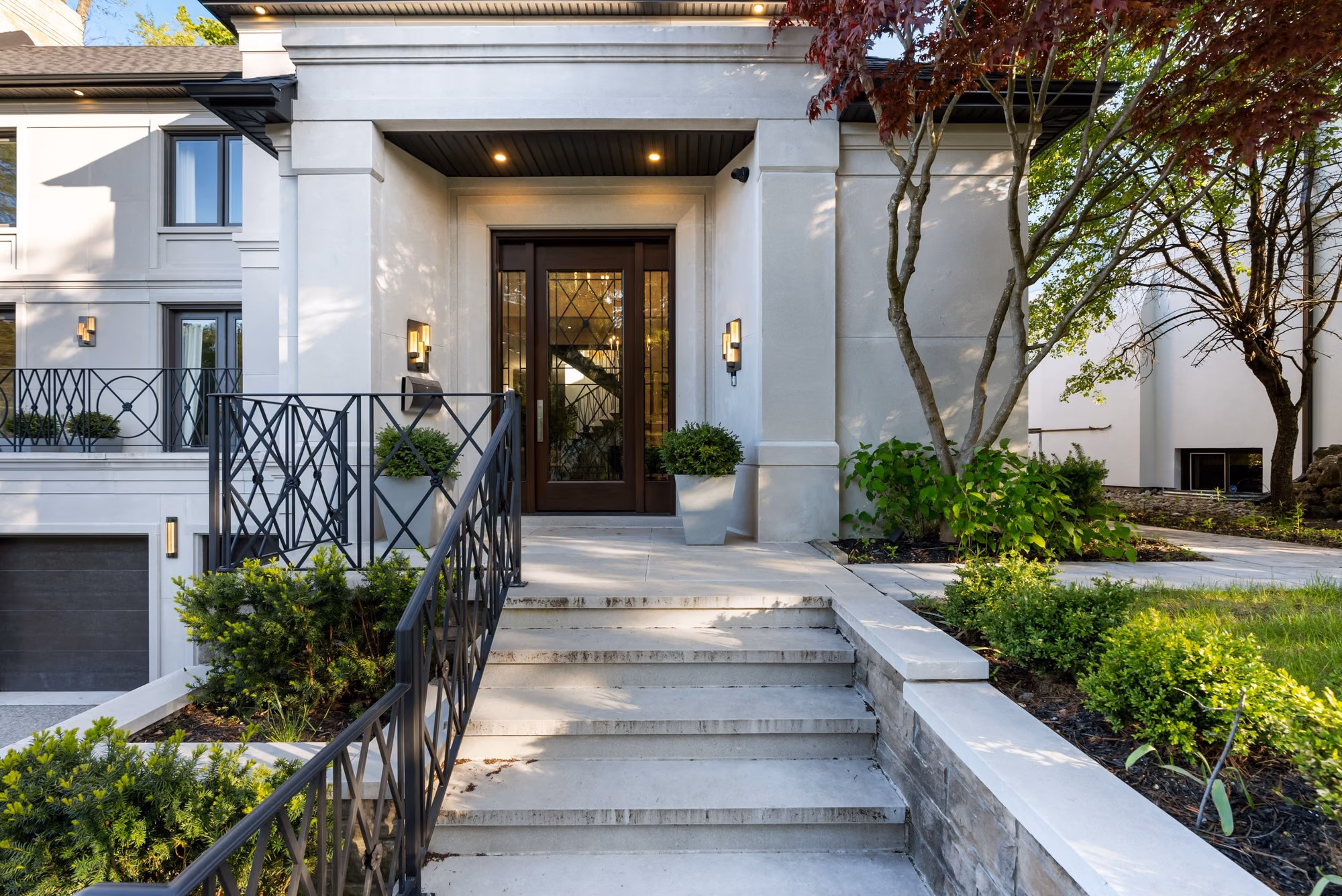 Stone entrance steps through landscaped garden