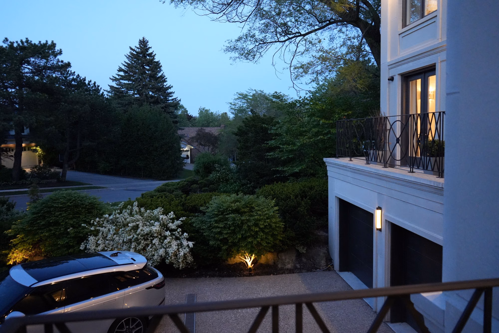 Balcony view over the driveway at blue hour