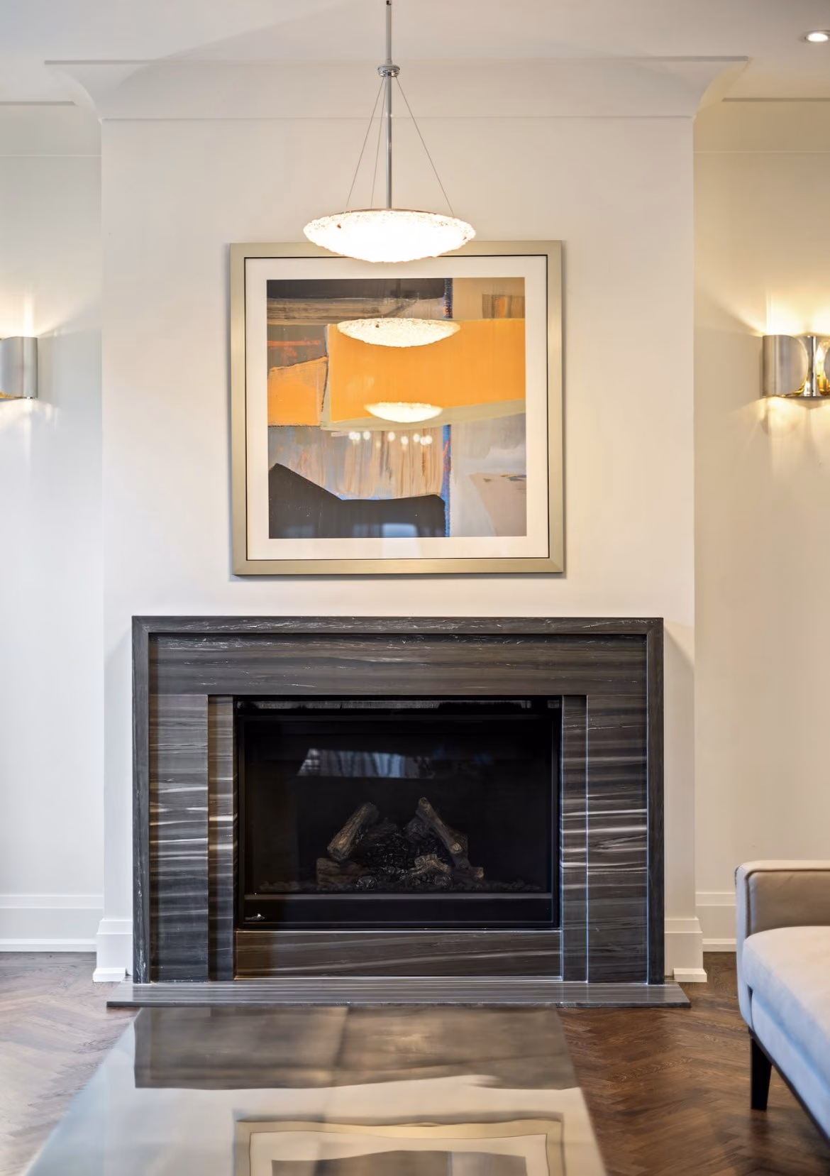Finished living room fireplace with artwork above