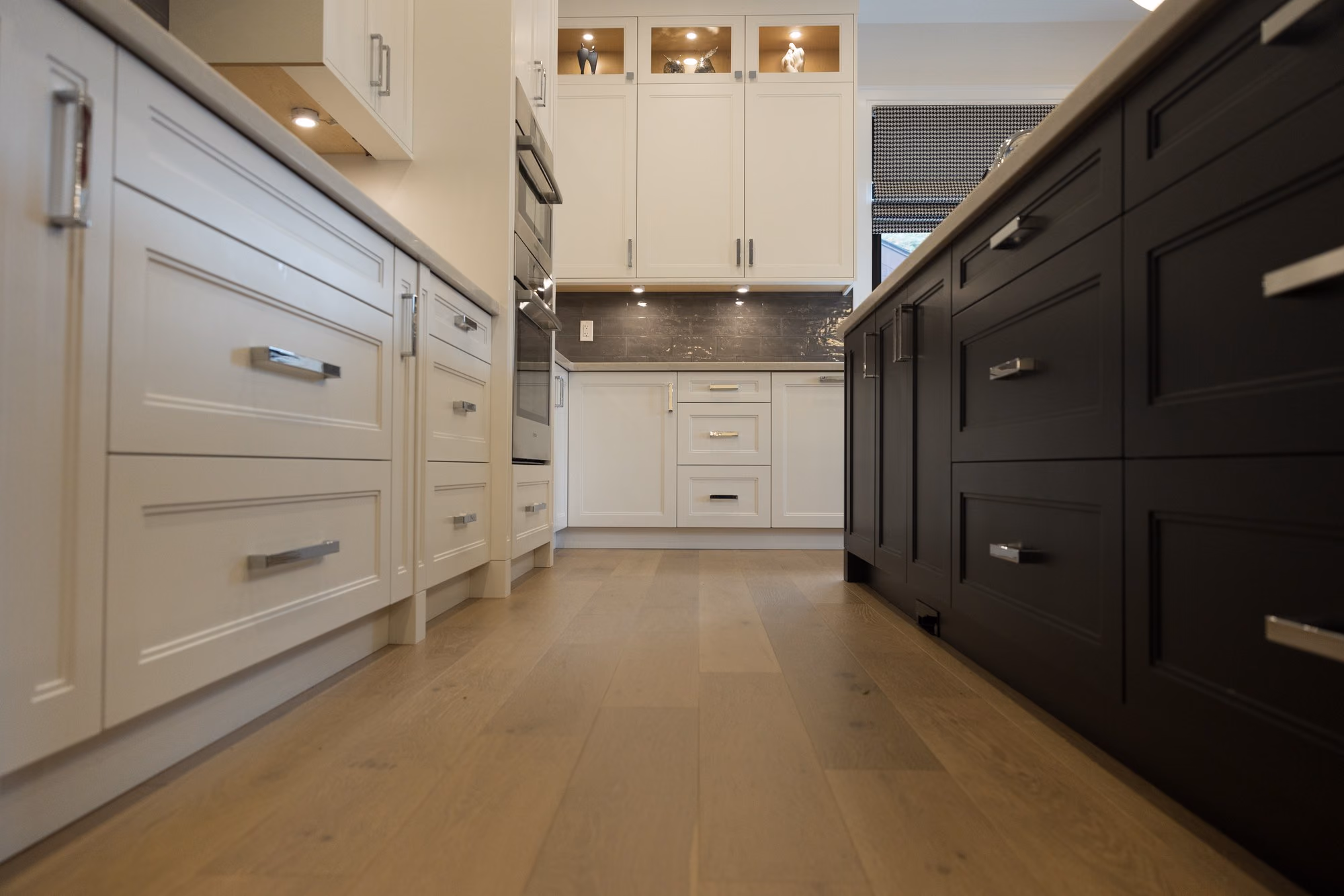 Farmhouse kitchen with cream cabinetry and black island