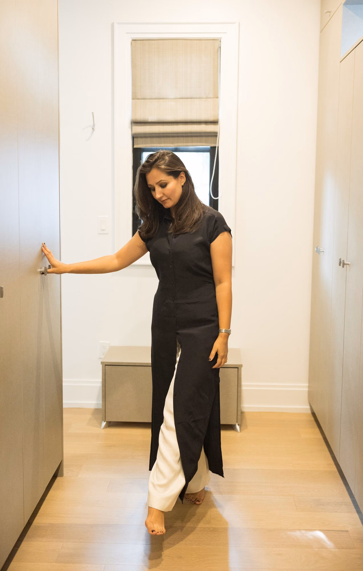 Designer walking through the walk-in closet