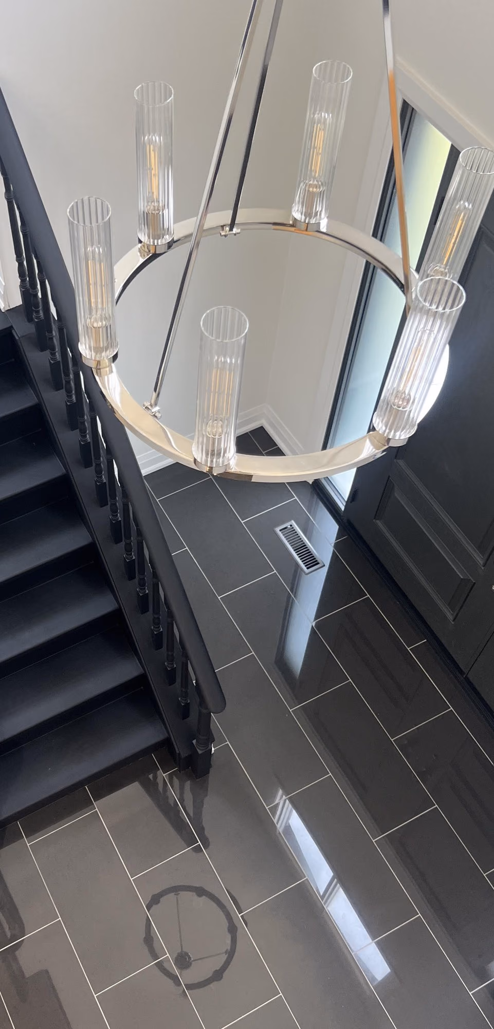 Ring chandelier over the renovated staircase