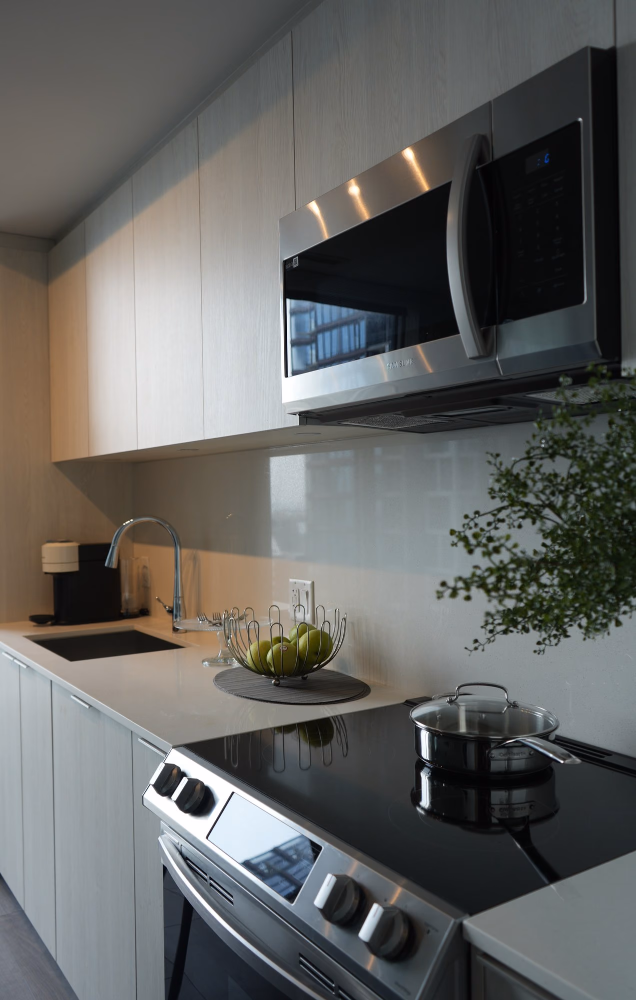 Compact corporate kitchen in light wood